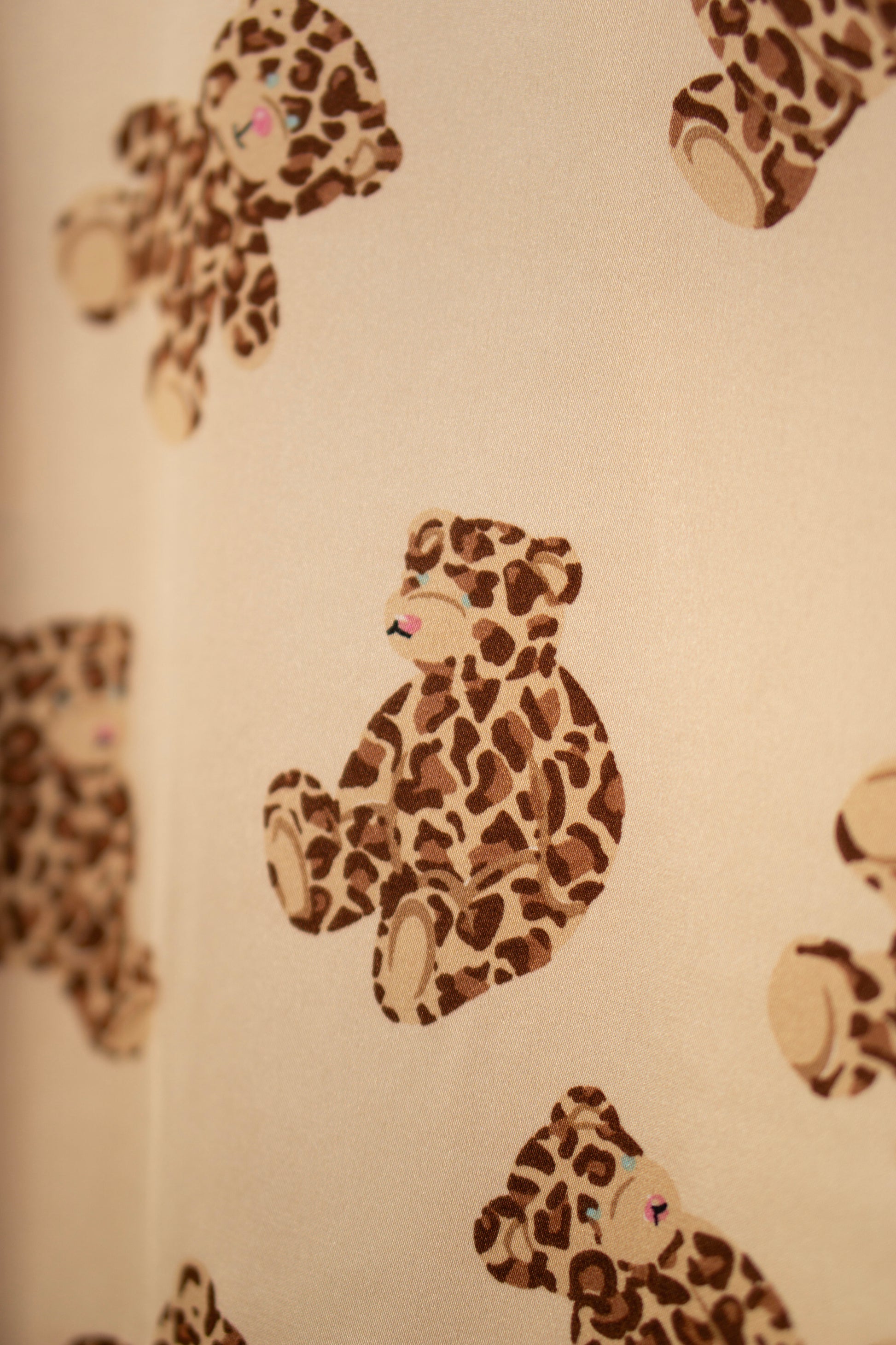 Satin Pajama Set has Leopard print teddy bear pattern on a beige background