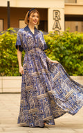 Blue bohemian printed maxi shirt dress for women with button-down front and modest silhouette, the dress shirt has a solid colour collar and sleeve cuffs. The dress also consist of pockets!
