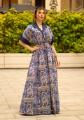 Blue bohemian printed maxi shirt dress for women with button-down front and modest silhouette, the dress shirt has a solid colour collar and sleeve cuffs. The dress also consist of pockets!