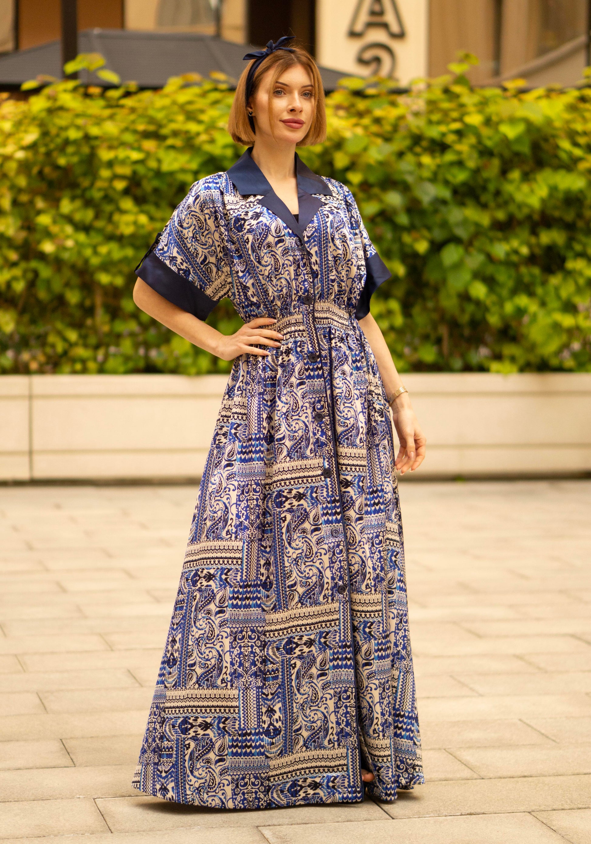 Blue bohemian printed maxi shirt dress for women with button-down front and modest silhouette, the dress shirt has a solid colour collar and sleeve cuffs. The dress also consist of pockets!