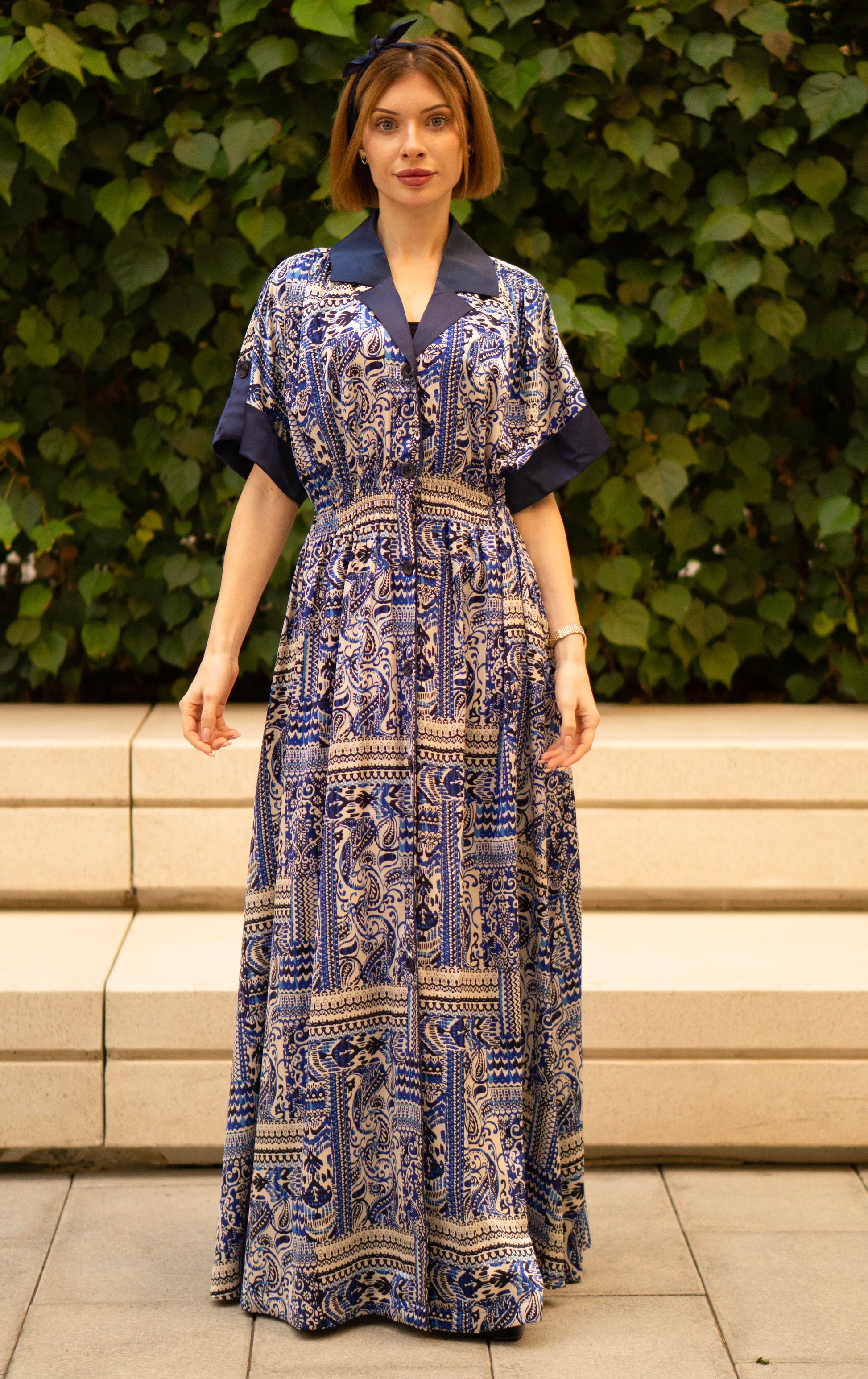 Blue bohemian printed maxi shirt dress for women with button-down front and modest silhouette, the dress shirt has a solid colour collar and sleeve cuffs. The dress also consist of pockets!