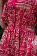 Red bohemian printed maxi shirt dress for women with button-down front and modest silhouette, the dress shirt has a solid colour collar and sleeve cuffs. The dress also consist of pockets!