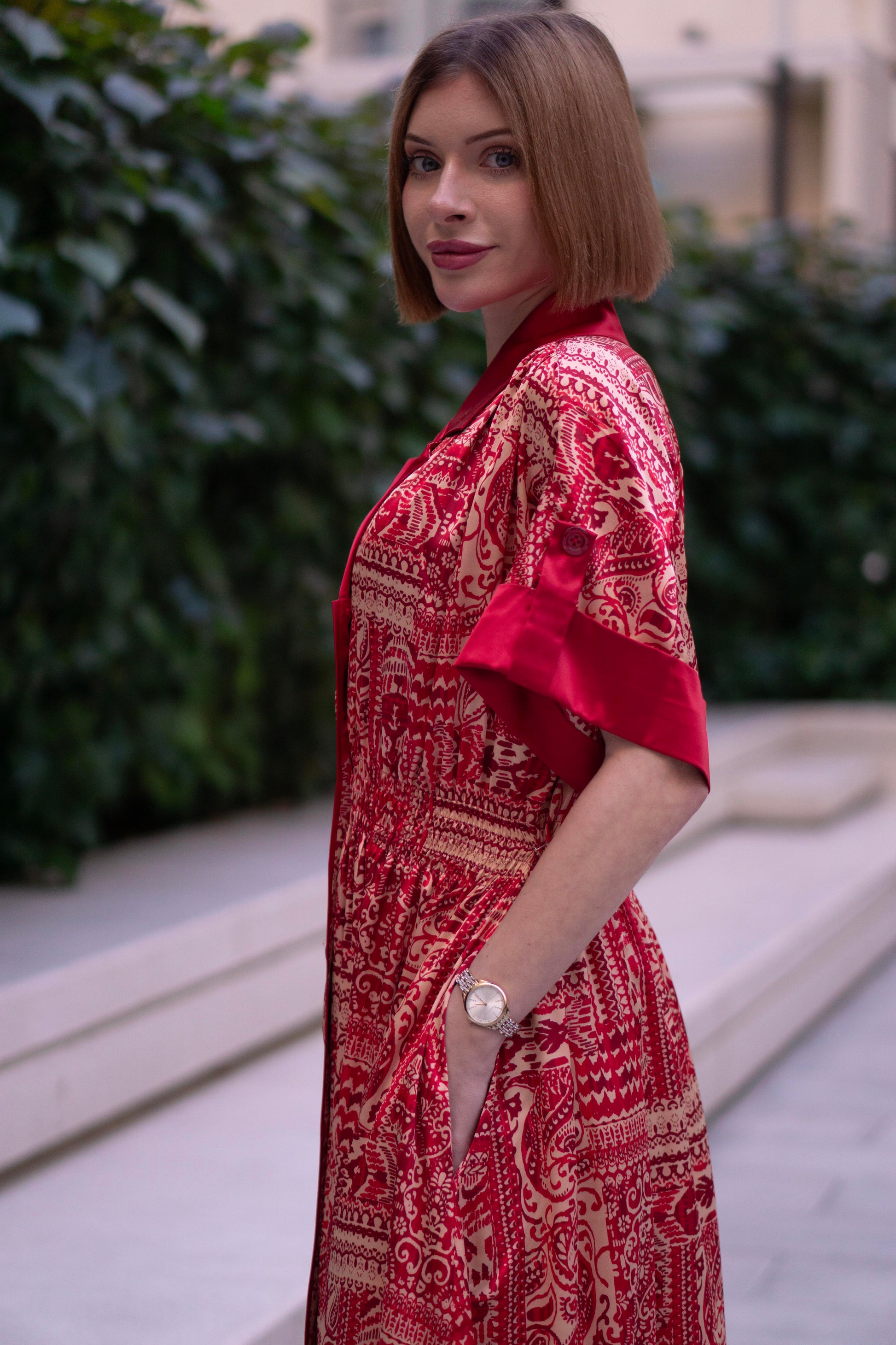 Red bohemian printed maxi shirt dress for women with button-down front and modest silhouette, the dress shirt has a solid colour collar and sleeve cuffs. The dress also consist of pockets!
