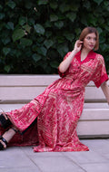 Red bohemian printed maxi shirt dress for women with button-down front and modest silhouette, the dress shirt has a solid colour collar and sleeve cuffs. The dress also consist of pockets!
