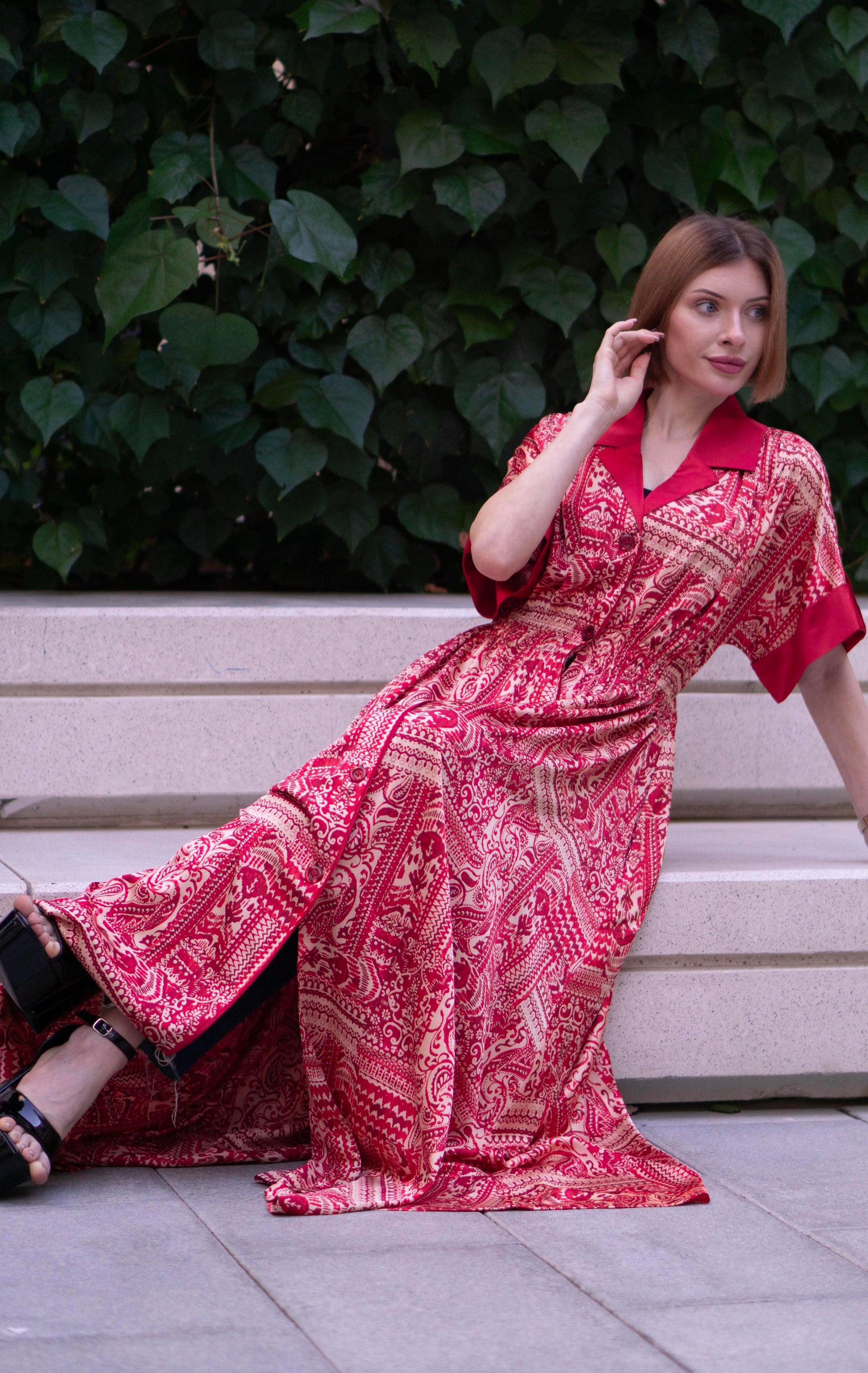 Red bohemian printed maxi shirt dress for women with button-down front and modest silhouette, the dress shirt has a solid colour collar and sleeve cuffs. The dress also consist of pockets!
