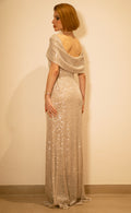 Back view of beige cowl evening dress with silver sequins and draped neckline
